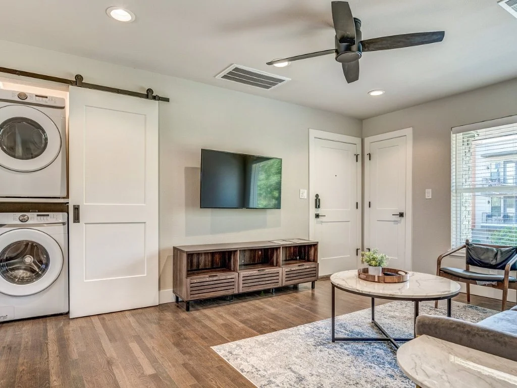 White Rock Views living room with an included 50-inch television, hardwood-style flooring, and seating