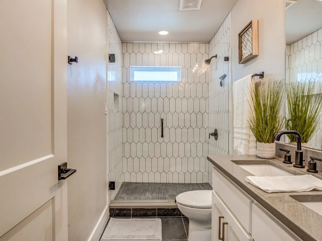 Renovated bathroom with a tiled walk-in shower